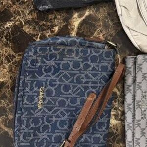 Calvin Klein Navy Monogram Pouch with Brown Strap